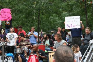 Illustration for article titled "Radiohead Wouldn't Play In The Big East Either": Occupy Wall Street Has An "Occupy Herbstreit" Photobomber